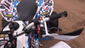 Close-up of ASV F3 adjustable-reach clutch lever and Oury grip on Honda 400EX.