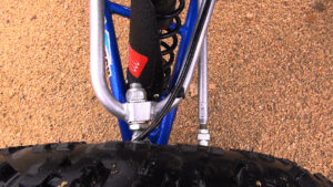 Close-up of Teixeira Tech upper A-arm showing easy to adjust caster system.