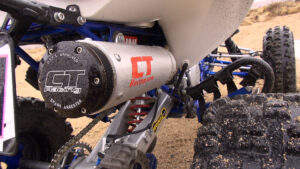 Rear right-side image showing CT Racing Sonic exhaust silencer on the Honda 400EX build.