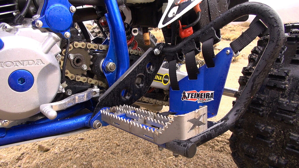 Left-side view of Honda 400EX showing Teixeira Tech heel guard and footpeg with Pro Design shifter.