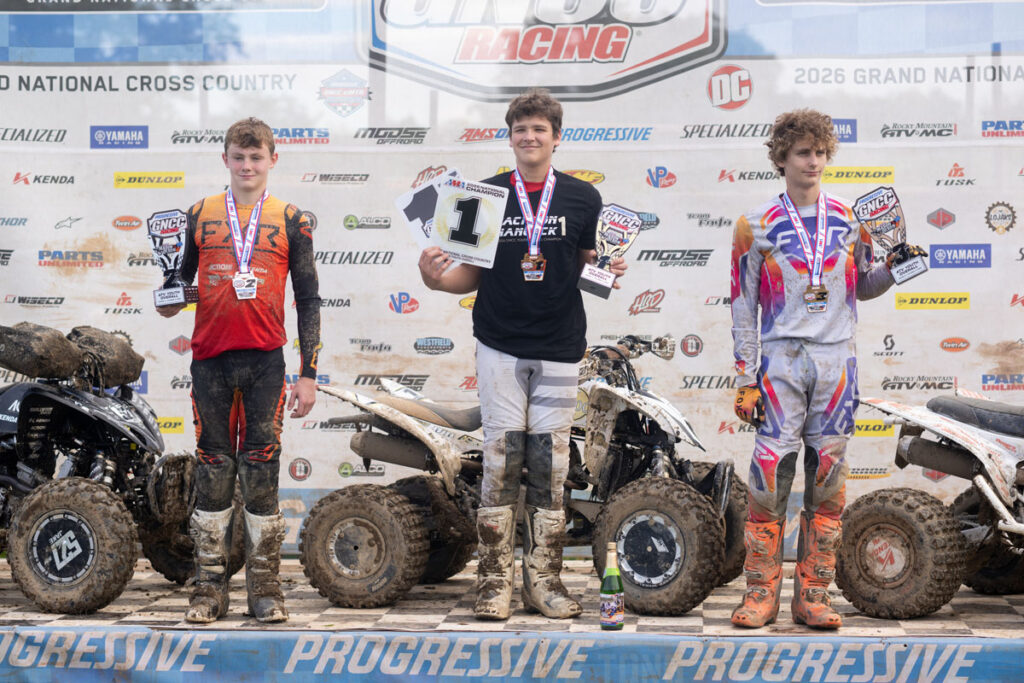 Youth ATV podium with Jackson Hancock center, Jacob Smallwood left, and Bodie Buckhannon right.