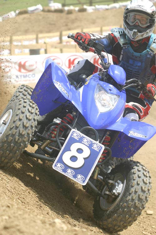 John Natalie riding a blue KYMCO ATV at the 2004 KYMCO Cup at Daniel Boone