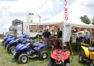 KYMCO ATVs and display tent in the pits at Daniel Boone in 2004