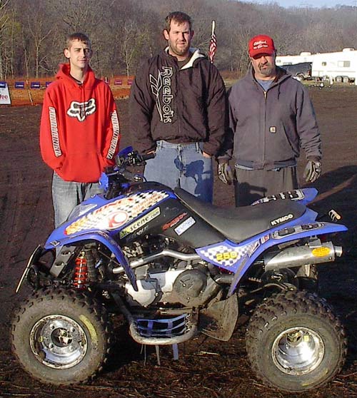 Brad Morrison, Nathan Delabar and Jack Moore behind their KYMCO Mongoose 250