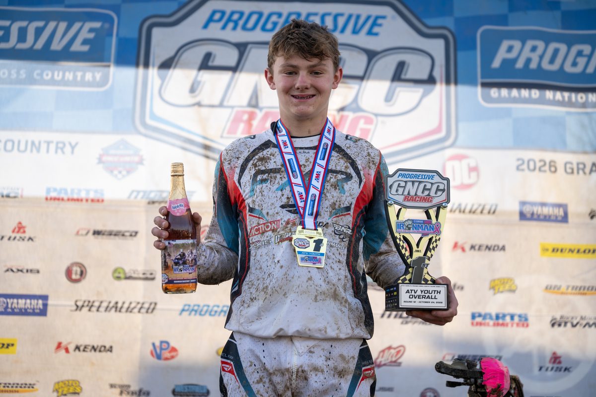Jacob Smallwood holds his Youth ATV overall winner trophy at the 2026 Ironman GNCC
