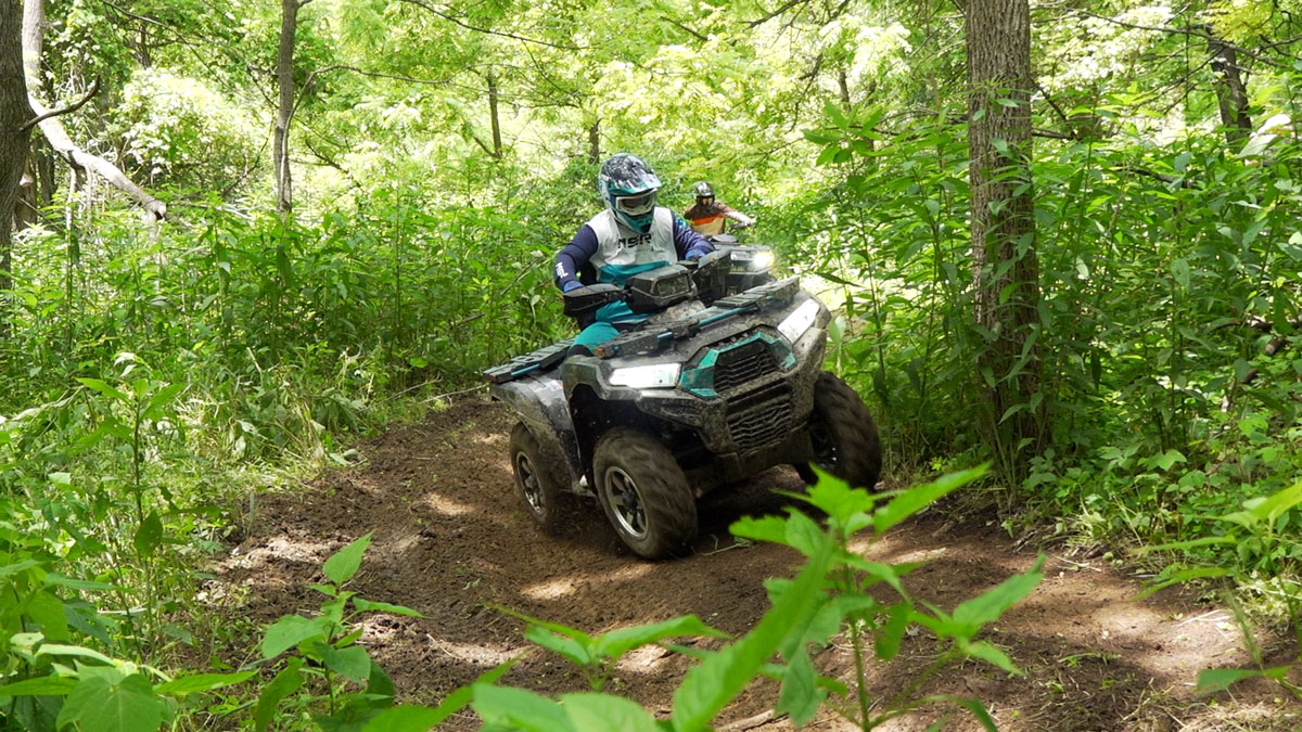 Brute Force 750 leaning through an S-curve, showing mild body roll.